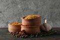 Bowls with different powder spices and ingredients on wooden background Royalty Free Stock Photo