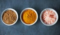 Bowls of flavor. an assortment of colorful spices in bowls.