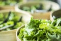 Bowls Of Fresh Organic Lettuce Leaves In Salad Bar Display