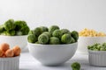 Bowls of frozen vegetables: brussels sprouts, peas, broccoli, corn, peas, carrots on a white plate. Royalty Free Stock Photo