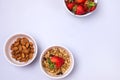 Bowls with Granola or Muesli Bowl with Strawberry and Almond Blue Background Healthy Diet Breakfast Top View Flat Lay Copy Space