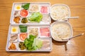 Bowls of GuoQiaoMiXian Chinese rice noodles and ingredients