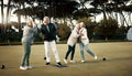 Bowls, high five and celebration with senior friends outdoor, cheering together during a game. Motivation, support or Royalty Free Stock Photo