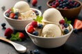 bowls with ice cream scoops and berries