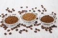 Bowls with instant and ground coffee, coffee beans on table Royalty Free Stock Photo