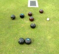 Bowls, jack, and mat lying on bowling green Royalty Free Stock Photo