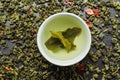 Bowls with leaf green oolong tea and strawberries Royalty Free Stock Photo