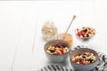 Bowls with muesli, dried berries and