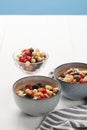 Bowls with muesli, dried berries and