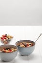 Bowls with muesli, dried berries and