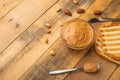 Bowls of peanut butter and peanuts on a dark wooden background from top view, rich breakfast Royalty Free Stock Photo