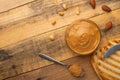 Bowls of peanut butter and peanuts on a dark wooden background from top view, rich breakfast Royalty Free Stock Photo