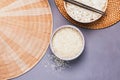 Bowls with raw and cooked white long grain rice Royalty Free Stock Photo