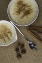 Bowls of rice pudding and cinnamon Royalty Free Stock Photo