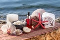 Bowls with sea salt, bottles with aromatic oil, candle, orchid f Royalty Free Stock Photo