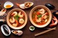 Bowls of seafood soup with mussels and delicate pink shrimp