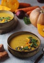 Bowls served with seasonal pumpkin soup Royalty Free Stock Photo