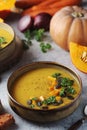 Bowls served with seasonal pumpkin soup Royalty Free Stock Photo