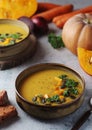 Bowls served with seasonal pumpkin soup Royalty Free Stock Photo