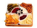 Bowls with snacks on bamboo tray