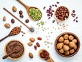 Bowls and spoons of various legumes and different kinds of nuts Royalty Free Stock Photo