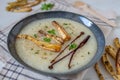 Bowls with tasty creamy soup of parsnip