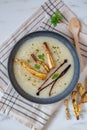 Bowls with tasty creamy soup of parsnip