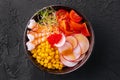 Bowls with tasty rice, shrimps and vegetables on dark background Royalty Free Stock Photo