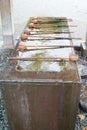 Bowls in temple of Japan for wash hand and mouth Royalty Free Stock Photo