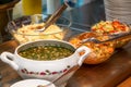 Bowls with various food in self service restaurant Royalty Free Stock Photo