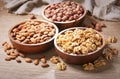 Bowls of various mixed nuts on wooden background. Walnut, hazelnut and almond nuts