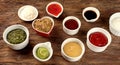 Bowls of various sauces on rustic wooden background Royalty Free Stock Photo