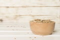 Bowls with wholegrain spelt farro on wooden table