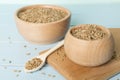 Bowls with wholegrain spelt farro on wooden table