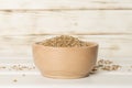 Bowls with wholegrain spelt farro on wooden table