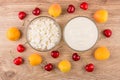 Bowls with yogurt and cottage cheese, sweet cherries and apricot Royalty Free Stock Photo