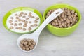 Bowls with yogurt and extruded rye bran, plastic spoon