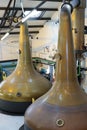 The copper stills of the Bowmore whisky distillery on Islay Royalty Free Stock Photo