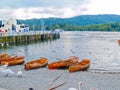 Boats on shore of Lake Windermere Lake District National Park