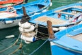 Bows of traditional fishing boats moored close-up