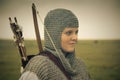 Bows woman / medieval armor / retro split toned Royalty Free Stock Photo