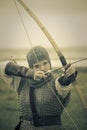 Bows woman / medieval armor / retro split toned Royalty Free Stock Photo