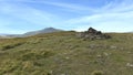 Bowscale Fell summit shelter behind cairn Royalty Free Stock Photo