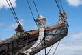 Bowsprit and jib boom with reefed sails on the bow of a historic Royalty Free Stock Photo