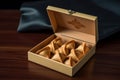 Box of American fortune cookies. Traditional treat with prediction, lucky numbers and phrases in Chinese