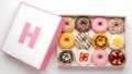 A box of assorted donuts with creative toppings and colorful frosting Royalty Free Stock Photo