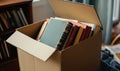 Box of assorted vintage books ready for storage or donation Royalty Free Stock Photo