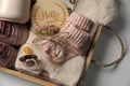 Box with baby clothes, shoes and accessories on light background, top view Royalty Free Stock Photo