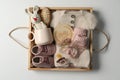 Box with baby clothes, shoes and accessories on light background, top view Royalty Free Stock Photo