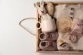 Box with baby clothes, shoes and accessories on light background, top view. Space for text Royalty Free Stock Photo